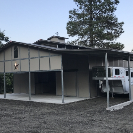 RCA Barn with Gable Style Porch and Covered Horse Trailer Parking.