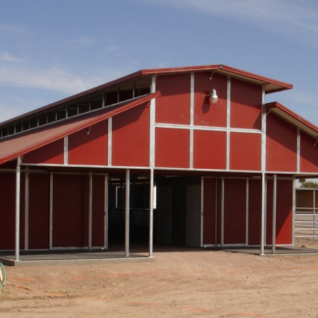 Red RCA Barn with RCA Style Porch with Cross Tie Area.